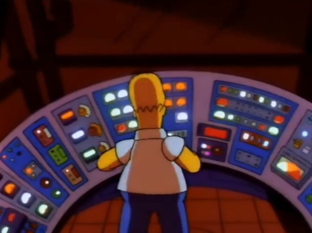 Homer Simpson seen from behind at a curved control panel covered in lights.